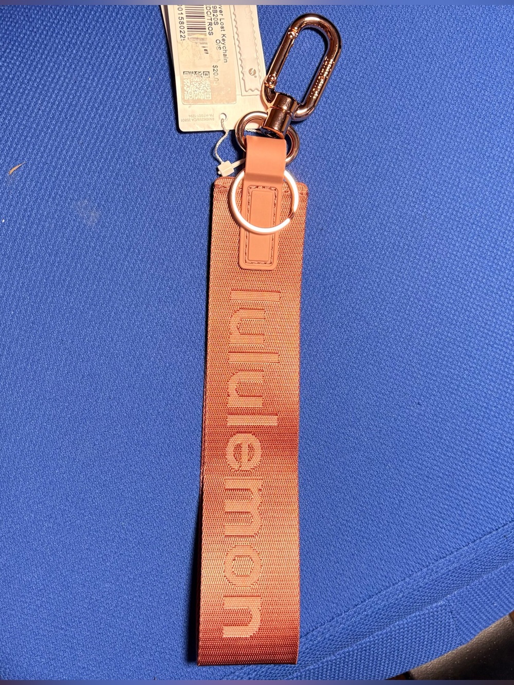 Lululemon Never Lost keychain NWT Sold Out: Red Clay/Tea Rose.